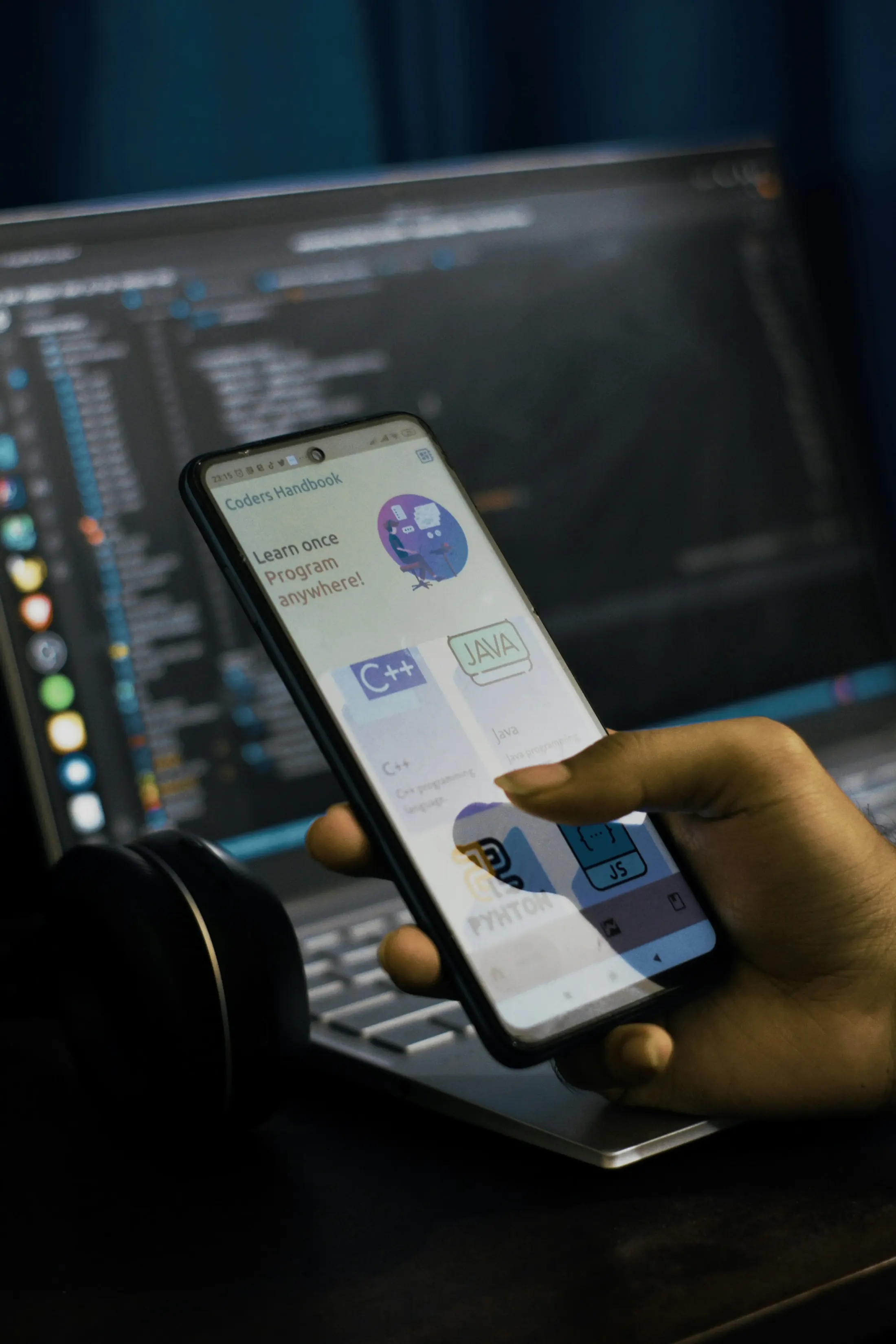 Person using a programming app on a phone